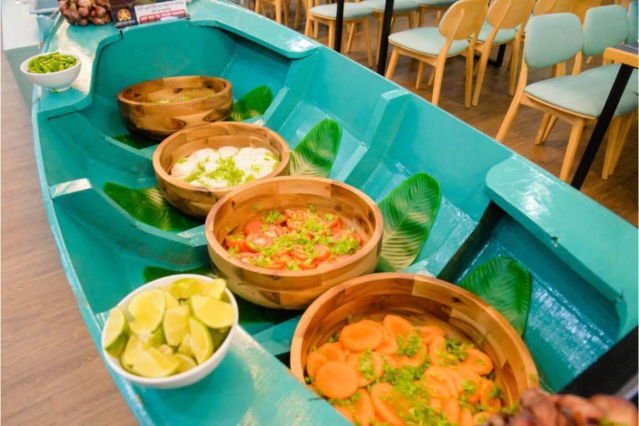 Fresh salad station displayed in a boat-style counter at Benaras Pearl Phu Quoc