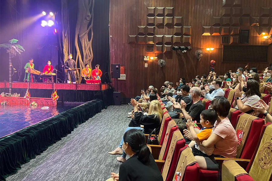 customer watching Water Puppet Show