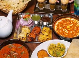 Indian curry set with naan, dal, and tandoori dishes at Maharaja Phu Quoc