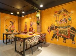 Spacious dining area with warm decor at Makhan Bhog Indian Restaurant