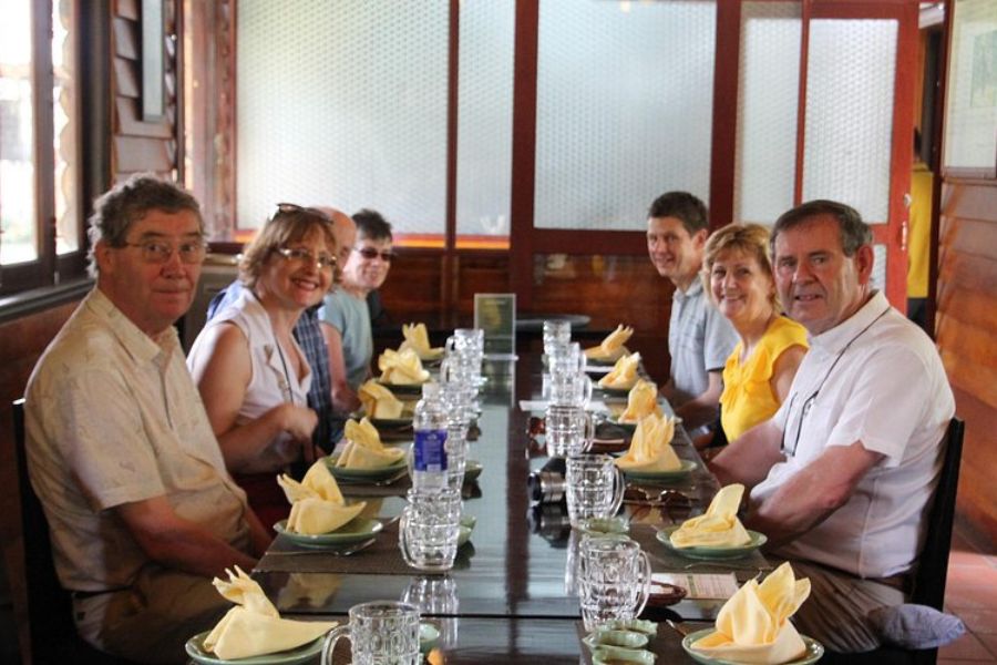 International guests enjoying a group lunch at a local restaurant