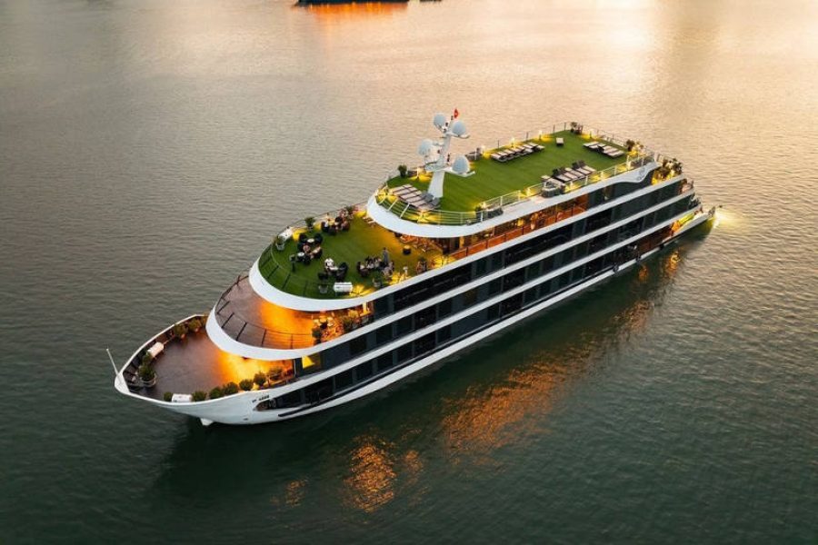 Venus Cruise Halong sailing through limestone karsts, operated by Vietnam DMC for luxury travel