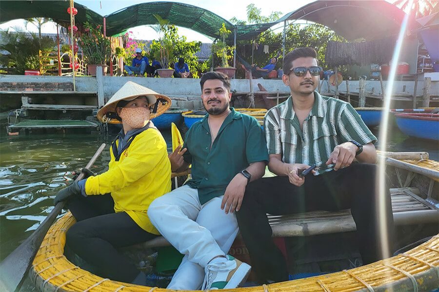 Men enjoying a basket boat ride in Hoi An