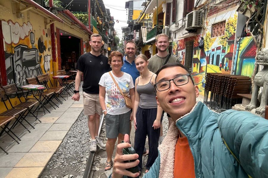 Tourists taking photos at Hanoi Train Street