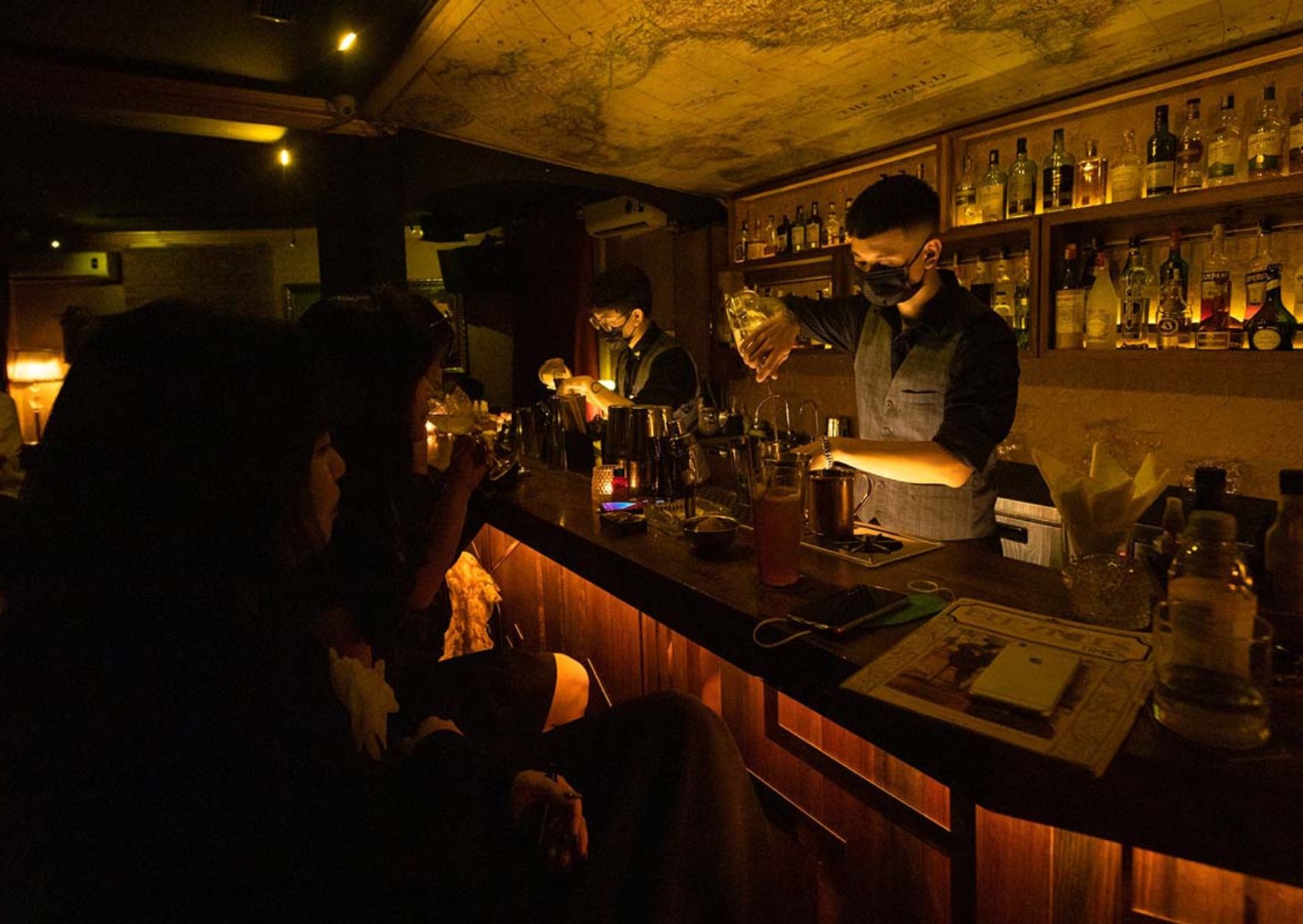 Bartenders mixing drinks at Bee'Znees bar