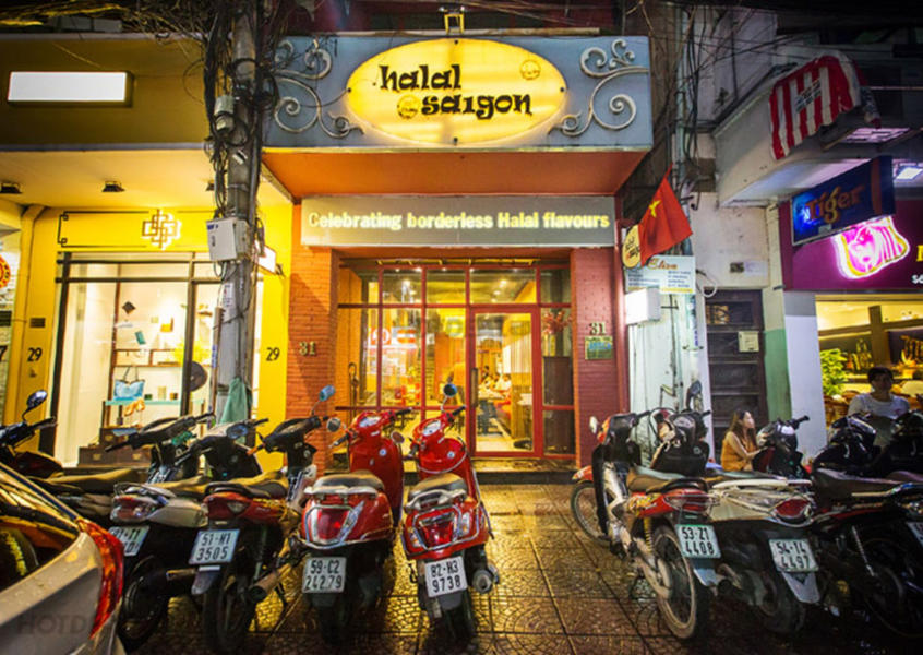 Halal Saigon restaurant exterior on Dong Du Street at night