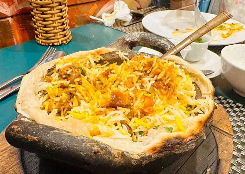 Chicken biryani served in traditional clay pot at Nabil House
