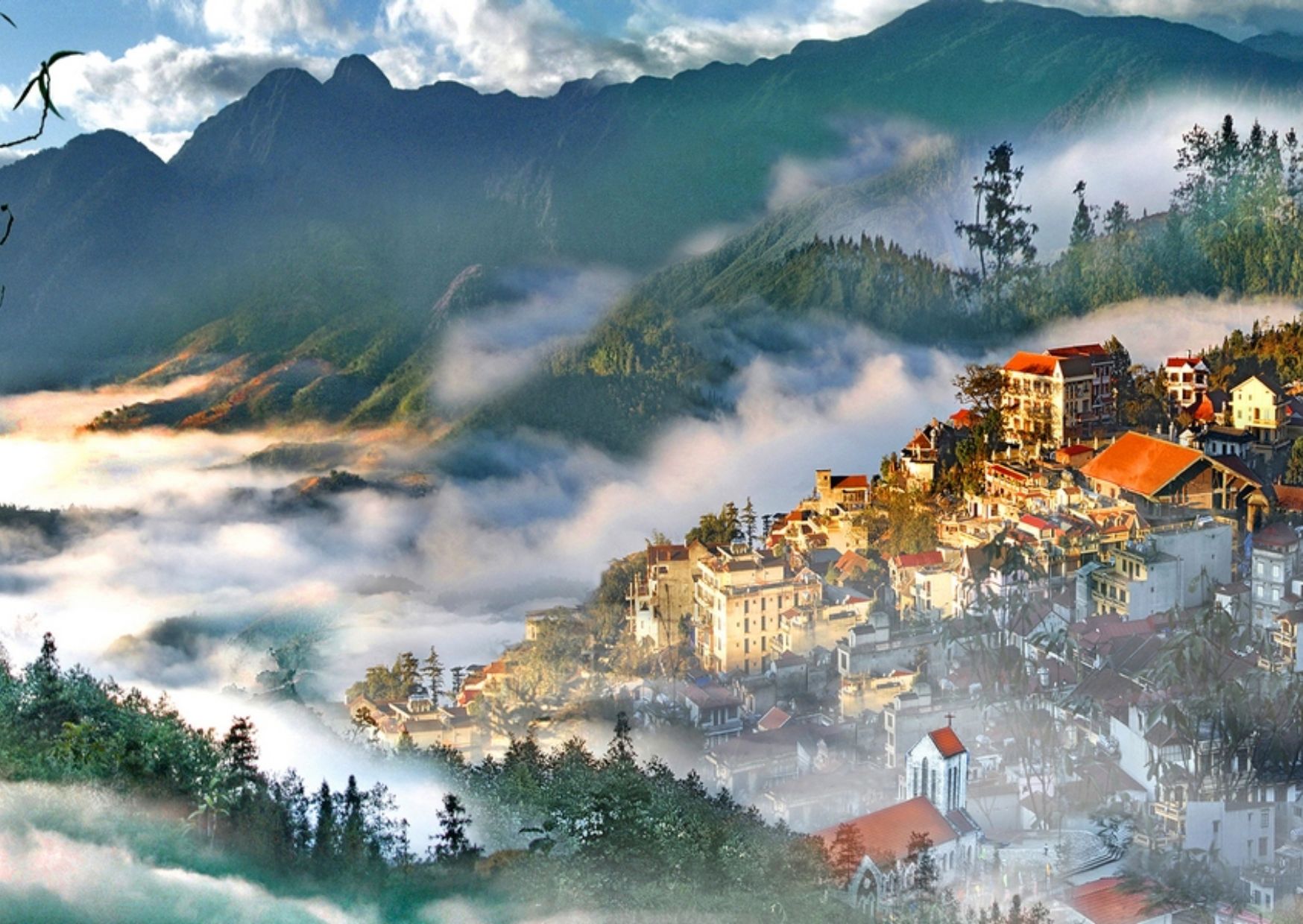 Sapa town valley covered in morning mist and clouds