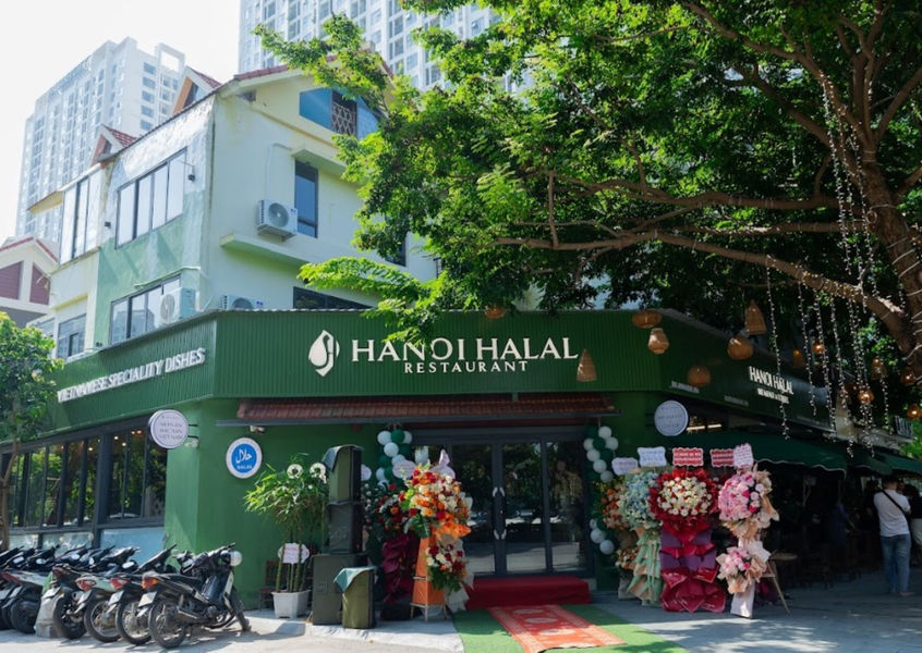 Exterior of Hanoi Halal Restaurant with green storefront