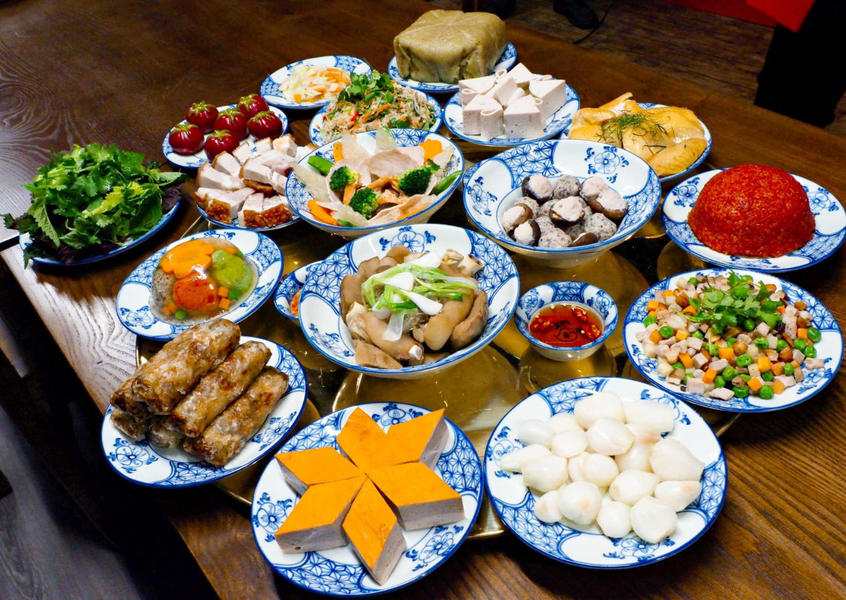 A traditional Vietnamese feast spread across blue-and-white porcelain dishes