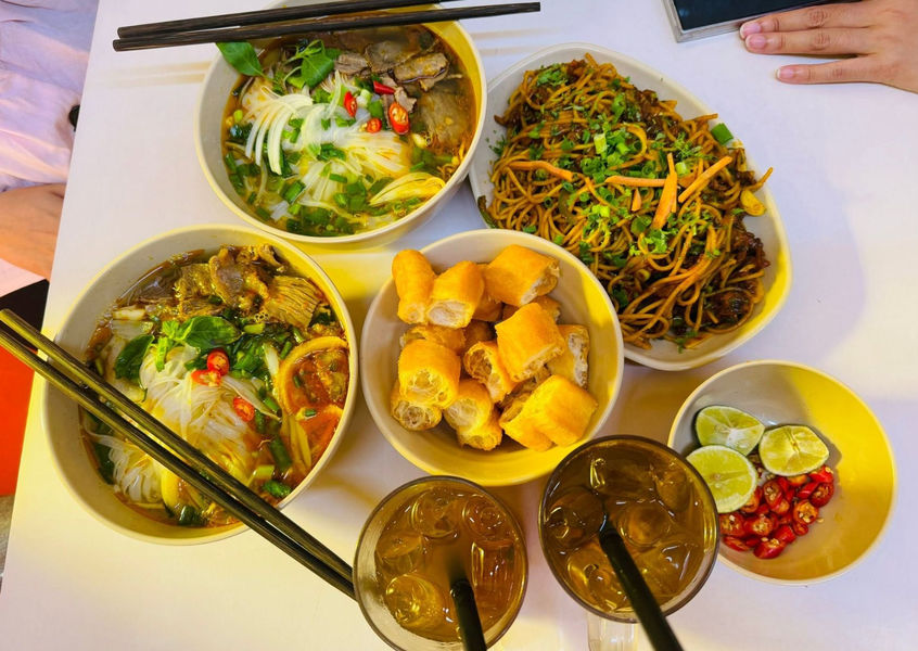 Vietnamese noodles, fried noodles and dough sticks on table