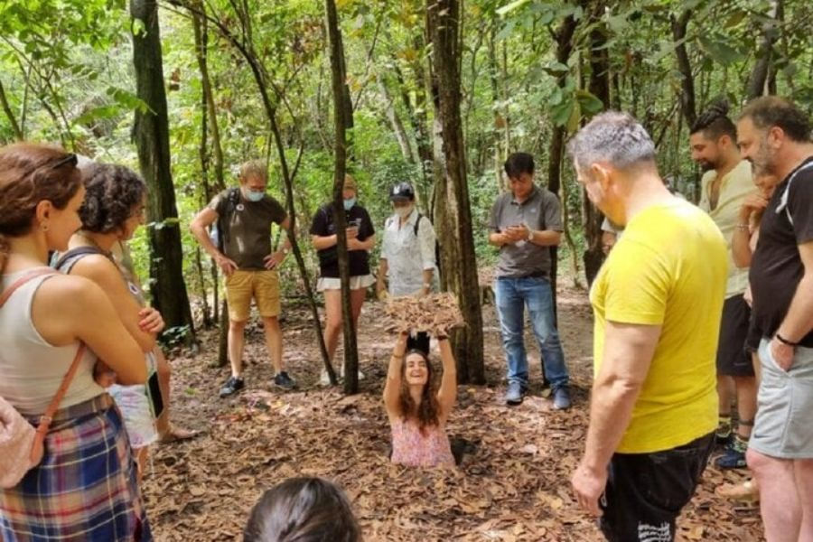Tour group gathered at the Cu Chi Ben Dinh tunnel site
