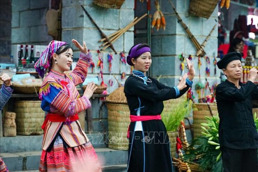 Ethnic minority women in traditional dress at a highland market