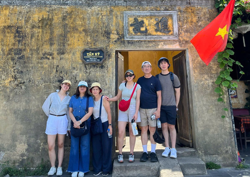 Family group at Tan Ky ancient house entrance, Hoi An