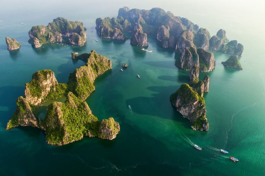 Aerial view of Ha Long Bay's limestone islands and boats
