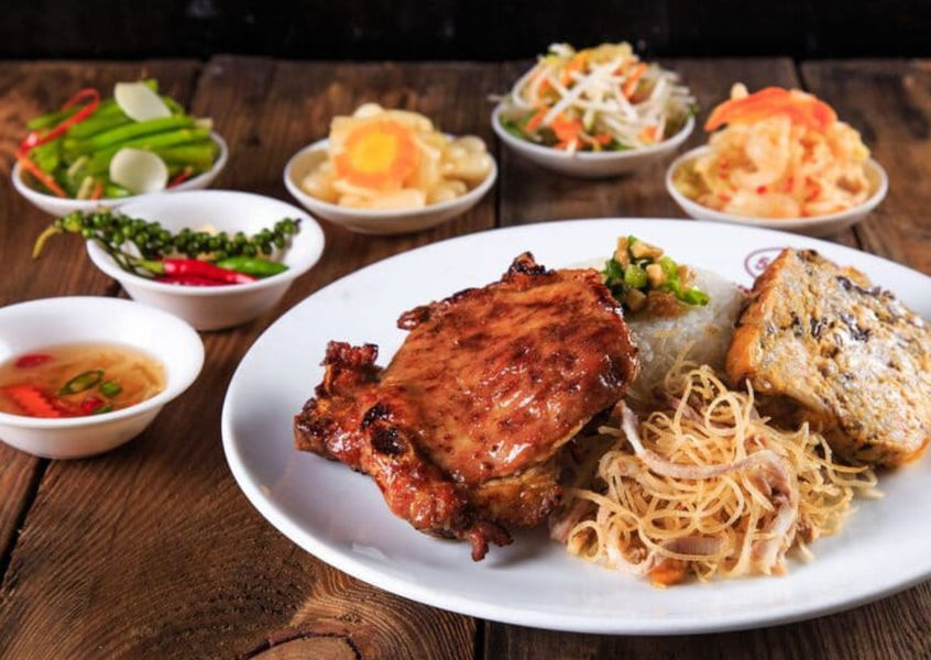 Cơm tấm grilled pork rice plate with pickled sides, Saigon