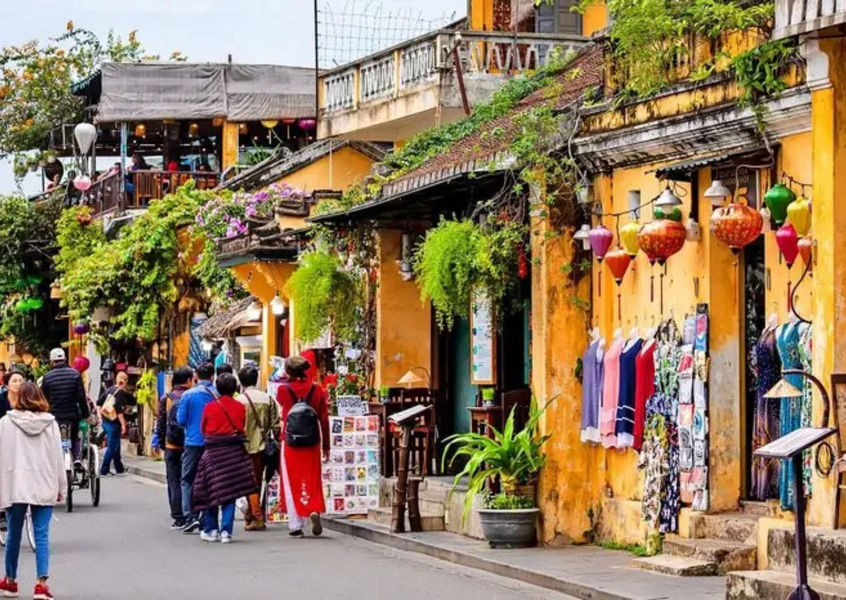 Yellow facades and lanterns along a Hoi An Ancient Town street