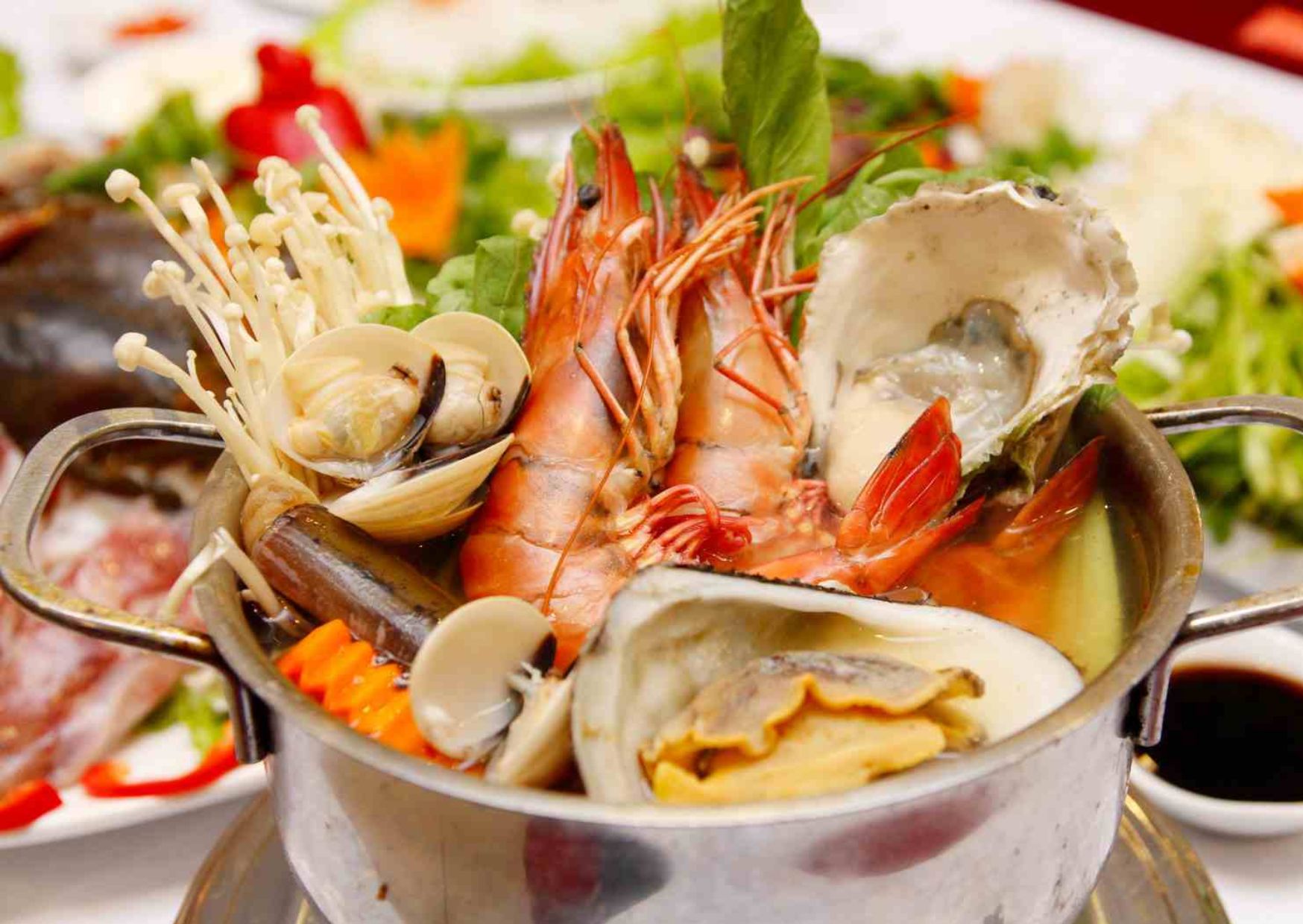 Seafood hotpot with prawns, oysters, and clams in Nha Trang