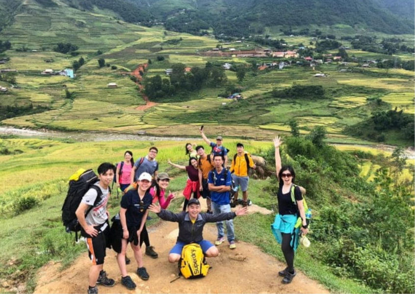 Group of trekkers posing at a Sapa valley viewpoint