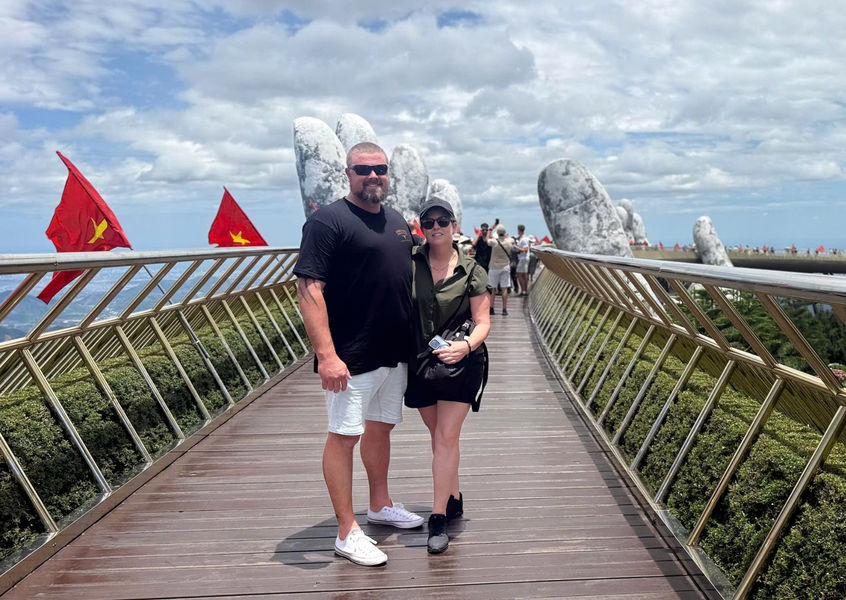Couple posing at Golden Bridge, Ba Na Hills, Da Nang
