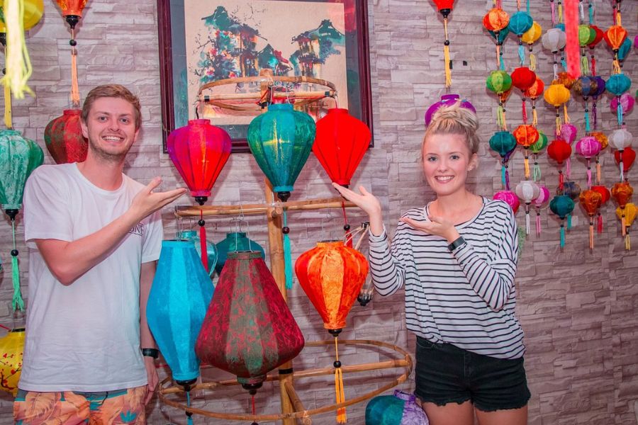 Travelers with lanterns at Hoi An Handicraft Tours workshop