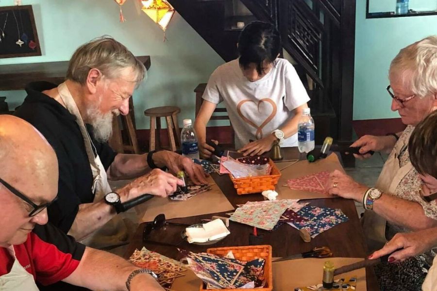 Travelers making lanterns at Reaching Out Hoi An workshop