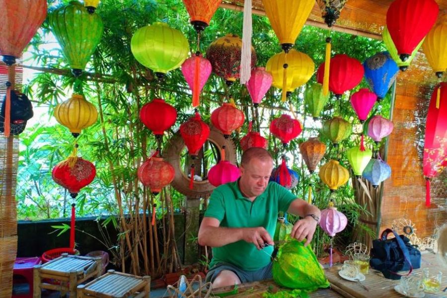 Traveler making a lantern during Tra Que Village combo tour