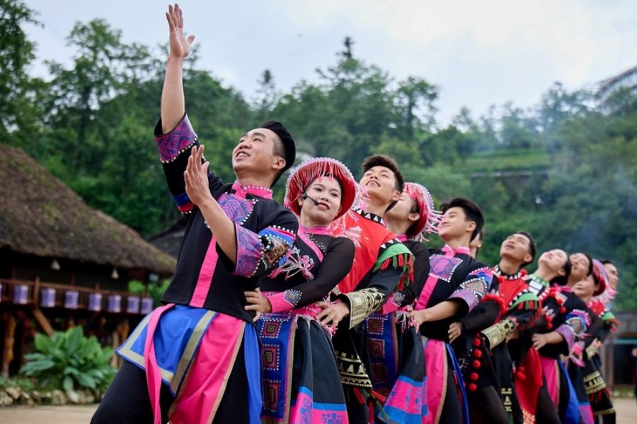 Traditional Thai ethnic dancers performing the Xoe dance in colorful costumes, Vietnam